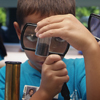 student with magnifying glass
